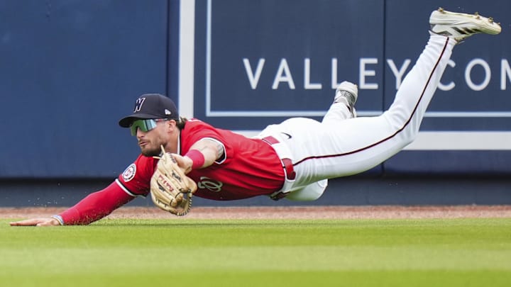 Mar 4, 2025; West Palm Beach, Florida, USA; Washington Nationals outfielder Dylan Crews (3) catches a fly ball for an out against the St. Louis Cardinals during the second inning at CACTI Park of the Palm Beaches. 