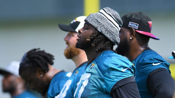 Jacksonville Jaguars offensive tackle Anton Harrison (77) watches drills during the organized team activity session Monday, June 3, 2024 at EverBank Stadium's Miller Electric Center in Jacksonville, Fla.