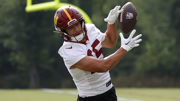 Jul 27, 2023; Ashburn, VA, USA; Washington Commanders wide receiver Dax Milne (15) attempts to catch a pass on day two of Commanders training camp at OrthoVirginia Training Center. Mandatory Credit: Geoff Burke-Imagn Images