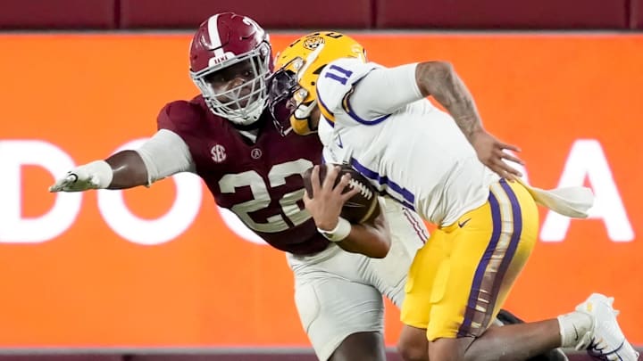 Nov 8, 2025; Tuscaloosa, Alabama, USA;  Alabama defensive lineman LT Overton (22) chases and sacks LSU quarterback Michael Van Buren Jr. (11) for a loss at Saban Field at Bryant-Denny Stadium. Alabama defeated LSU 20-9. Mandatory Credit: Gary Cosby Jr.-Imagn Images