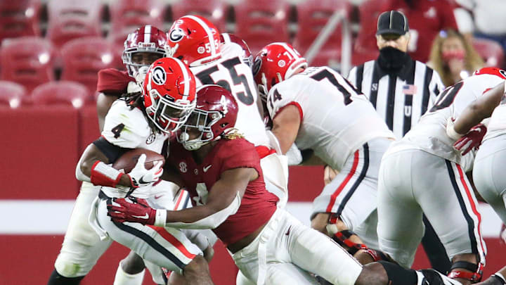 Alabama linebacker Christopher Allen (4) tackles Georgia running back James Cook (4) for a loss during Alabama's 41-24 win over Georgia in Bryant-Denny Stadium Saturday, Oct. 17, 2020. [Staff Photo/Gary Cosby Jr.]

Alabama Vs Georgia Sec Football