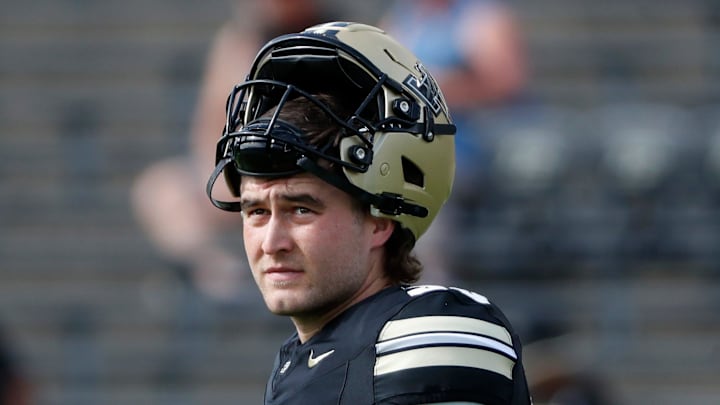 Purdue Boilermakers punter Keelan Crimmins (30) looks down field Saturday, Aug. 31, 2024, ahead of the NCAA football game at Ross-Ade Stadium in West Lafayette, Ind.