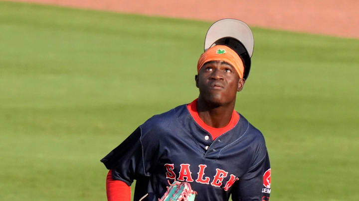 Salem outfielder Natanael Yuten (22) loses his hat as he runs for the ball during the 19th annual Military Appreciation game at SRP Park in North Augusta, S.C., on July 12, 2025. Salem outfielder Natanael Yuten (22) loses his hat as he runs for the ball during the 19th annual Military Appreciation game at SRP Park in North Augusta, S.C., on July 12, 2025.