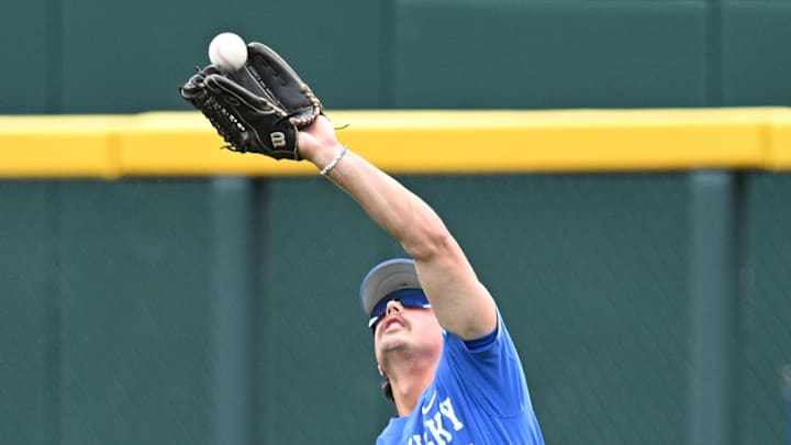 Jun 19, 2024; Omaha, NE, USA;  Kentucky Wildcats right fielder Eli Small (54) makes a play against the Florida Gators during the ninth inning at Charles Schwab Field Omaha. Mandatory Credit: Steven Branscombe-Imagn Images