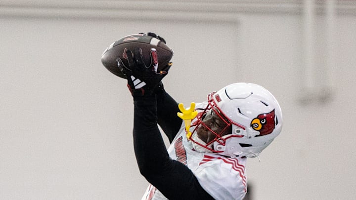 Louisville football wide receiver Chris Bell (0) runs drills during spring practice on Saturday, March 23, 2024 at the Trager practice facility in Louisville, Ky.