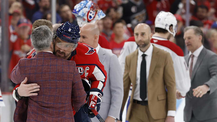 Apr 30, 2025; Washington, District of Columbia, USA; Montreal Canadiens head coach Martin St. Louis (L) hugs Washington Capitals left wing Alex Ovechkin (8) in the handshake line after game five of the first round of the 2025 Stanley Cup Playoffs at Capital One Arena. Mandatory Credit: Geoff Burke-Imagn Images