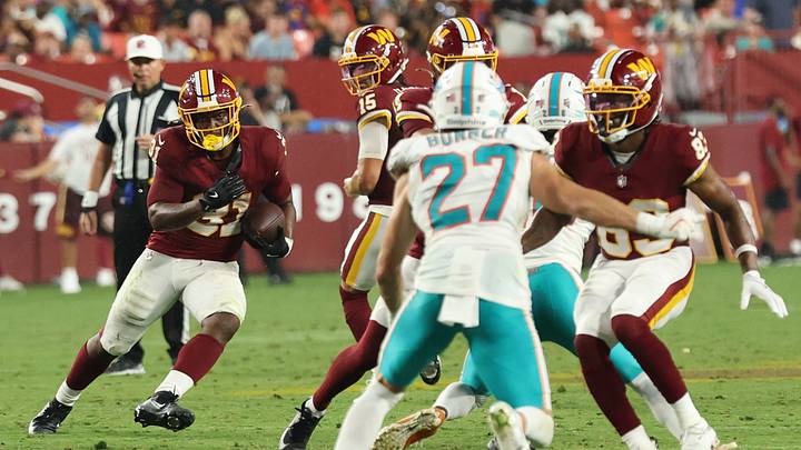 Washington Commanders running back Kaytron Allen (31) carries the ball as Miami Dolphins cornerback Ethan Bonner (27) chases during the first half at Northwest Stadium in the 2026 preseason. Washington Commanders running back Kaytron Allen (31) carries the ball as Miami Dolphins cornerback Ethan Bonner (27) chases during the first half at Northwest Stadium in the 2026 preseason.