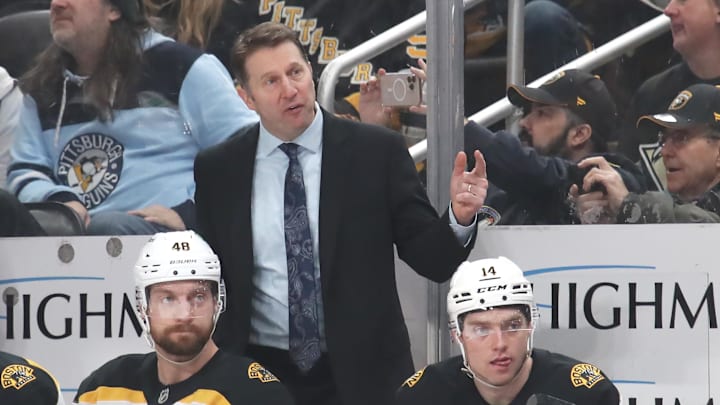 Mar 1, 2025; Pittsburgh, Pennsylvania, USA;  Boston Bruins interim head coach Joe Sacco (rear) reacts on the bench against the Pittsburgh Penguins during the third period at PPG Paints Arena. Mandatory Credit: Charles LeClaire-Imagn Images