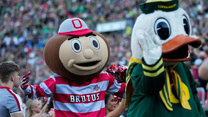 Oct 12, 2024; Eugene, Oregon, USA; Ohio State Buckeyes mascot Brutus and the Oregon Duck interact during the first half of the NCAA football game at Autzen Stadium