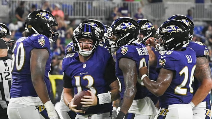 Aug 9, 2024; Baltimore, Maryland, USA; Baltimore Ravens quarterback Devin Leary (13) celebrates with teammates after scoring a touchdown  during the second half a of a preseason game against the Philadelphia Eagles at M&T Bank Stadium. Mandatory Credit: Tommy Gilligan-Imagn Images