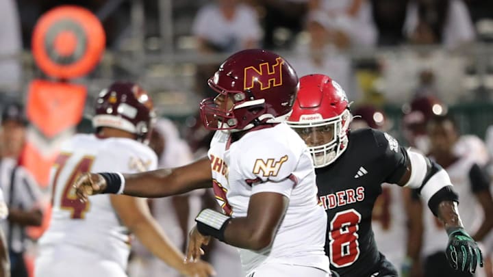 Savannah Christian's LaDamion Guyton pressures New Hampstead quarterback Rashawn Truell.