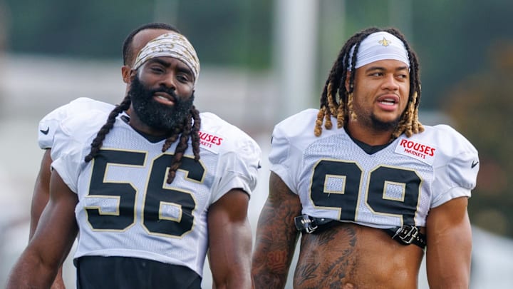 Jul 30, 2025; New Orleans, LA, USA;  New Orleans Saints linebacker Demario Davis (56) and defensive end Chase Young (99) during training camp at Ochsner Sports Performance Center. Mandatory Credit: Stephen Lew-Imagn Images