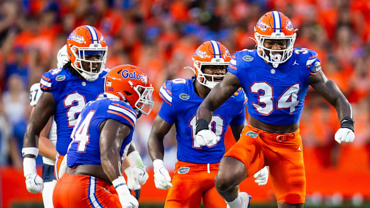 Florida Gators edge George Gumbs Jr. (34) celebrates tackling Samford Bulldogs wide receiver E. Jai Mason (3) during the first half at Ben Hill Griffin Stadium in Gainesville, FL on Saturday, September 7, 2024 against the Samford Bulldogs. [Doug Engle/Gainesville Sun]