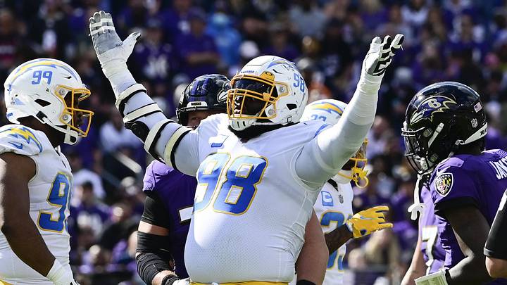 Oct 17, 2021; Baltimore, Maryland, USA;  Los Angeles Chargers defensive tackle Linval Joseph (98) reacts after sacking Baltimore Ravens quarterback Lamar Jackson (8) during the first half at M&T Bank Stadium. Mandatory Credit: Tommy Gilligan-USA TODAY Sports