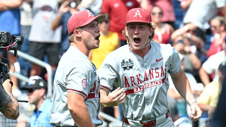 Jun 16, 2025; Omaha, Neb, USA;  Arkansas Razorbacks starting pitcher Gage Wood (14) celebrates with infielder Gabe Fraser (6) after throwing a no hitter against the Murray State Racers at Charles Schwab Field. Mandatory Credit: Steven Branscombe-Imagn Images