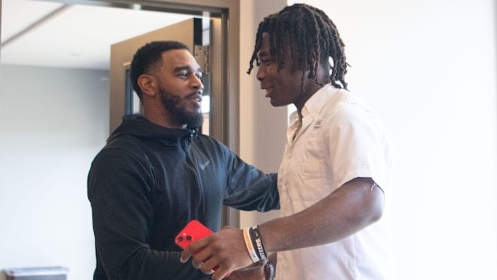 Edwin Spillman hugs Jamie Graham, head coach of Lipscomb s football team, after committing to Edwin Spillman hugs Jamie Graham, head coach of Lipscomb s football team, after committing to
