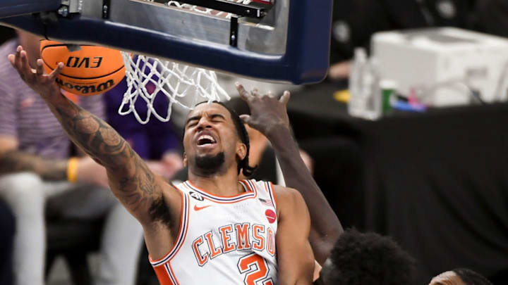 Clemson Tigers guard Dillon Hunter (2) drives to the basket while being guarded by Cincinnati Bearcats center Moustapha Thiam (52) Sunday, Dec. 21, 2025, during the NCAA men’s basketball game at Bon Secours Wellness Arena in Greenville, South Carolina.