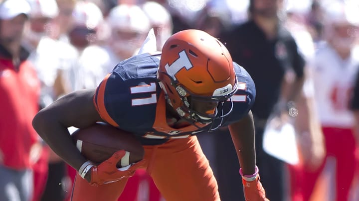Sep 2, 2017; Champaign, IL, USA; Illinois Fighting Illini wide receiver Malik Turner (11) eludes Ball State Cardinals cornerback Myles Hannah (21) during the fourth quarter at Memorial Stadium. Mandatory Credit: Mike Granse-Imagn Images Sep 2, 2017; Champaign, IL, USA; Illinois Fighting Illini wide receiver Malik Turner (11) eludes Ball State Cardinals cornerback Myles Hannah (21) during the fourth quarter at Memorial Stadium. Mandatory Credit: Mike Granse-Imagn Images
