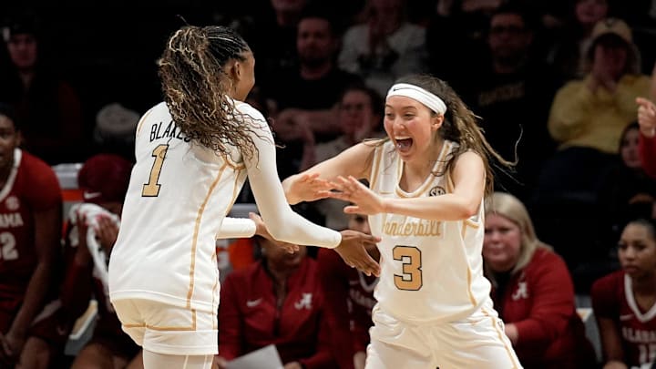 Vanderbilt’s Mikayla Blakes (1) celebrates with Aubrey Galvan (3) after Blakes made three point basket against Alabama during the second half of an NCAA college basketball game at Memorial Gymnasium Thursday, Feb. 26, 2026, in Nashville, Tenn. Vanderbilt won 85-60.