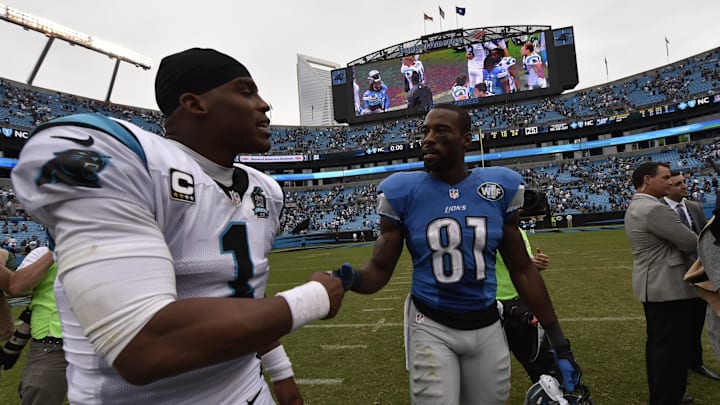 Sep 14, 2014; Charlotte, NC, USA; Carolina Panthers quarterback Cam Newton (1) with Detroit Lions wide receiver Calvin Johnson (81) after the game. The Panthers defeated the Lions 24-7 at Bank of America Stadium. 
