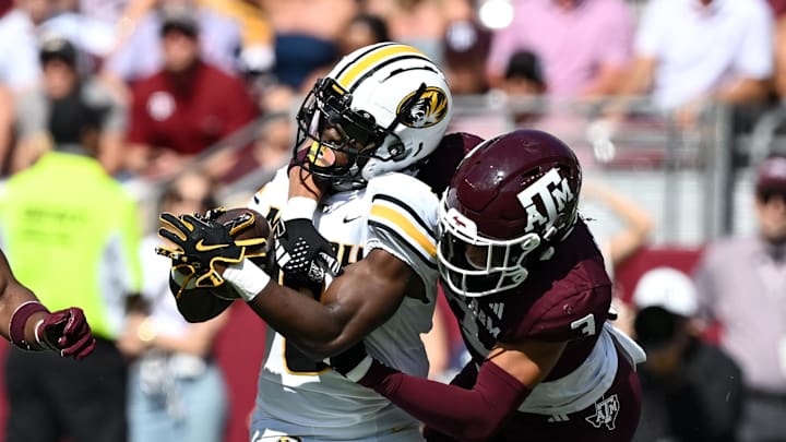 Oct 5, 2024; College Station, Texas, USA; Texas A&M Aggies defensive back Marcus Ratcliffe (3) tackles Missouri Tigers running back Nate Noel (8) in the first quarter at Kyle Field. Mandatory Credit: Maria Lysaker-Imagn Images. 