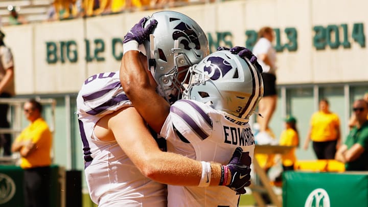 Kansas State running back Dylan Edwards celebrates with offensive lineman Will Anciaux after scoring a touchdown against Baylor. Kansas State running back Dylan Edwards celebrates with offensive lineman Will Anciaux after scoring a touchdown against Baylor.
