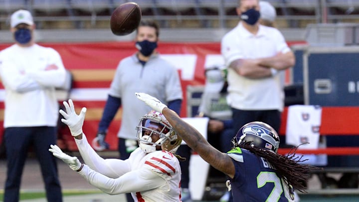 49ers wide receiver Richie James (13) makes a catch against Seattle Seahawks cornerback Shaquill Griffin (26)