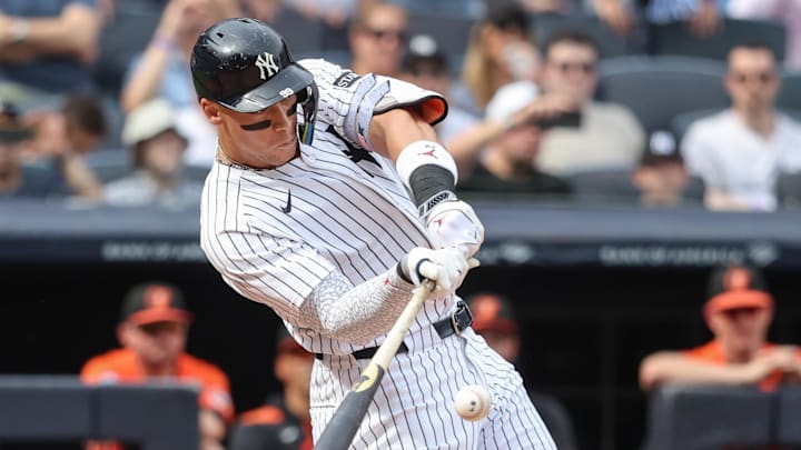Sep 27, 2025; Bronx, New York, USA;  New York Yankees right fielder Aaron Judge (99) hits a two run single in the fifth inning against the Baltimore Orioles at Yankee Stadium. Mandatory Credit: Wendell Cruz-Imagn Images