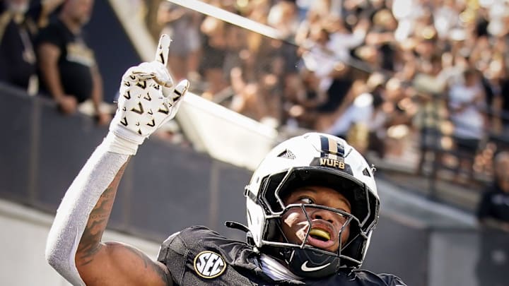 Vanderbilt running back Makhilyn Young (22) celebrates his touchdown against Utah State during the fourth quarter at FirstBank Stadium in Nashville, Tenn., Saturday, Sept. 27, 2025.