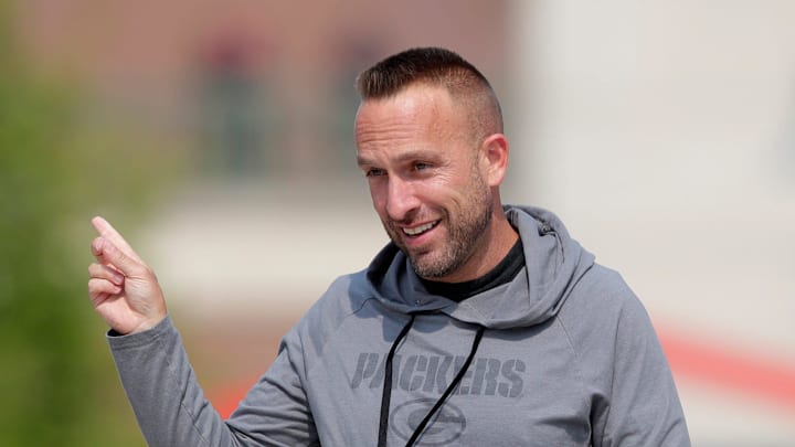 Green Bay Packers defensive coordinator Jeff Hafley interacts with fans before the start of practice on July 25, 2025, in Green Bay, Wis.