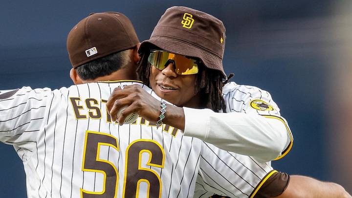 Seattle Seahawks wide receiver Rashid Shaheed (22) hugs San Diego Padres relief pitcher Jeremiah Estrada (56) after throwing out the first pitch before a game between the San Diego Padres and Detroit Tigers at Petco Park on March 27, 2026. Seattle Seahawks wide receiver Rashid Shaheed (22) hugs San Diego Padres relief pitcher Jeremiah Estrada (56) after throwing out the first pitch before a game between the San Diego Padres and Detroit Tigers at Petco Park on March 27, 2026.