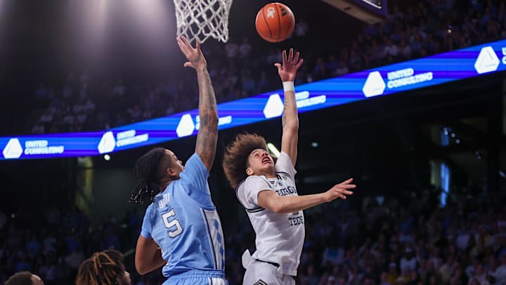 Jan 30, 2024; Atlanta, Georgia, USA; Georgia Tech Yellow Jackets guard Naithan George (2) shoots over North Carolina Tar Heels forward Armando Bacot (5) in the second half at McCamish Pavilion. Mandatory Credit: Brett Davis-Imagn Images