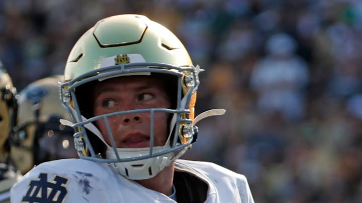 Notre Dame Fighting Irish quarterback Riley Leonard (13) crosses into the end zone for a touchdown Saturday, Sept. 14, 2024, during the NCAA football game against the Purdue Boilermakers at Ross-Ade Stadium in West Lafayette, Ind. Notre Dame Fighting Irish won 66-7.