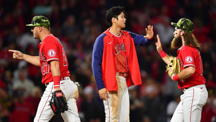 May 21, 2022; Anaheim, California, USA; Los Angeles Angels designated hitter Shohei Ohtani (17) celebrates with center fielder Mike Trout (27) and left fielder Brandon Marsh (16) the victory against the Oakland Athletics at Angel Stadium. 