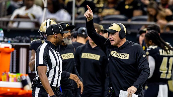 Nov 17, 2024; New Orleans, Louisiana, USA;  New Orleans Saints interim head coach Darren Rizzi talks to the referee against the Cleveland Browns during the first half at Caesars Superdome. Mandatory Credit: Stephen Lew-Imagn Images