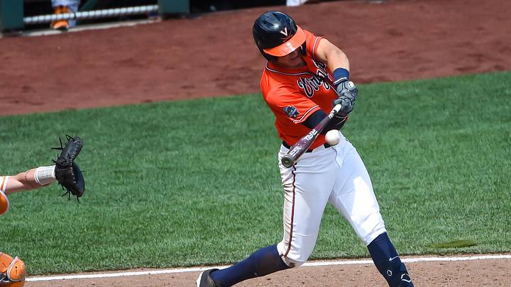 Jun 20, 2021; Omaha, Nebraska, USA; Virginia Cavaliers infielder Jake Gelof (22) drives in a run with a base hit in the seventh inning against the Tennessee Volunteers at TD Ameritrade Park. Mandatory Credit: Steven Branscombe-Imagn Images Jun 20, 2021; Omaha, Nebraska, USA; Virginia Cavaliers infielder Jake Gelof (22) drives in a run with a base hit in the seventh inning against the Tennessee Volunteers at TD Ameritrade Park. Mandatory Credit: Steven Branscombe-Imagn Images