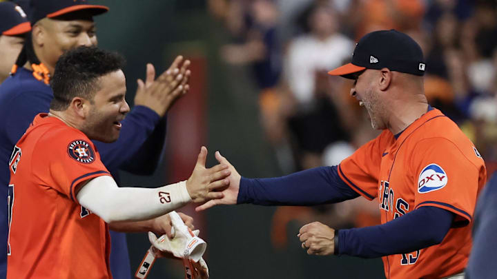 Aug 30, 2024; Houston, Texas, USA; Houston Astros manager Joe Espada (19) celebrates second baseman Jose Altuve (27)  walk off double to defeat the Kansas City Royals in the ninth inning at Minute Maid Park.