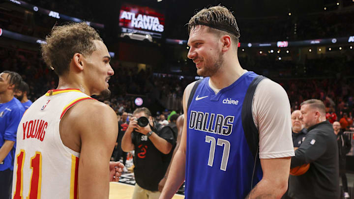Jan 26, 2024; Atlanta, Georgia, USA; Atlanta Hawks guard Trae Young (11) talks to Dallas Mavericks guard Luka Doncic (77) after a game at State Farm Arena. Mandatory Credit: Brett Davis-Imagn Images