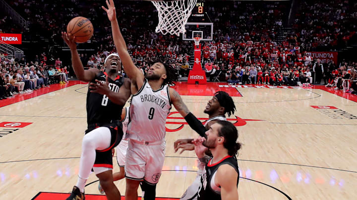 Feb 1, 2025; Houston, Texas, USA; Houston Rockets forward Jae'sean Tate (8) drives to the basket against Brooklyn Nets forward Trendon Watford (9) during the third quarter at Toyota Center. Mandatory Credit: Erik Williams-Imagn Images