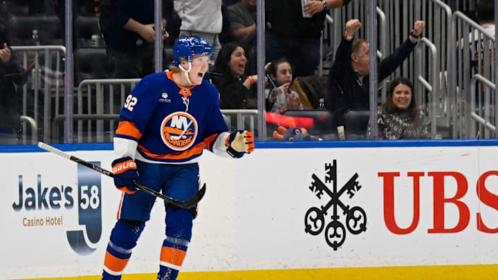 Mar 14, 2026; Elmont, New York, USA;  New York Islanders right wing Simon Holmstrom (92) celebrates his second goal against the Calgary Flames during the first period at UBS Arena. Mandatory Credit: Dennis Schneidler-Imagn Images