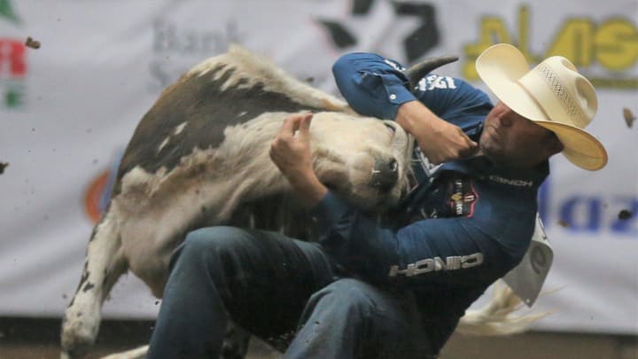 Tyler Waguespack competes in steer wrestling