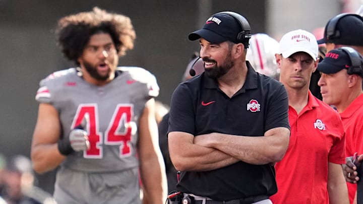 Oct 5, 2024; Columbus, OH, USA; Ohio State Buckeyes head coach Ryan Day smiles on the sideline during the first half of the NCAA football game against the Iowa Hawkeyes at Ohio Stadium.
