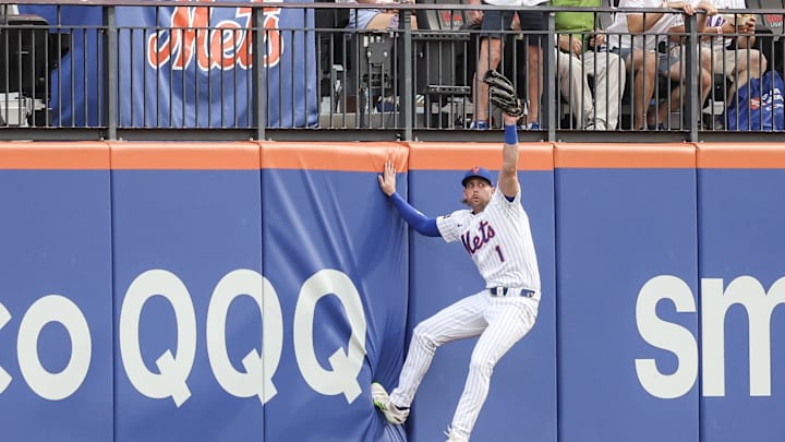 Jun 25, 2025; New York City, New York, USA;  New York Mets center fielder Jeff McNeil (1) reacts after making a leaping catch in the first inning against the Atlanta Braves at Citi Field. Mandatory Credit: Wendell Cruz-Imagn Images