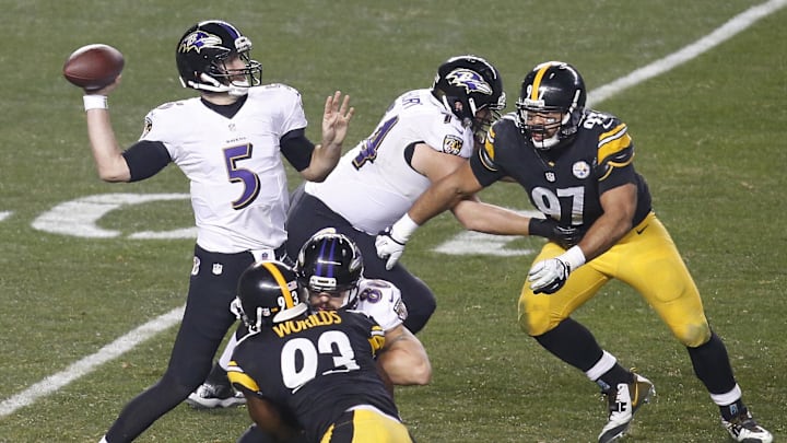 Jan 3, 2015; Pittsburgh, PA, USA; Baltimore Ravens quarterback Joe Flacco (5) throws the ball in front of Pittsburgh Steelers defensive end Cameron Heyward (97) during the second quarter in the 2014 AFC Wild Card playoff football game at Heinz Field. Mandatory Credit: Charles LeClaire-Imagn Images Jan 3, 2015; Pittsburgh, PA, USA; Baltimore Ravens quarterback Joe Flacco (5) throws the ball in front of Pittsburgh Steelers defensive end Cameron Heyward (97) during the second quarter in the 2014 AFC Wild Card playoff football game at Heinz Field. Mandatory Credit: Charles LeClaire-Imagn Images