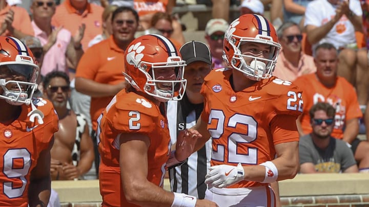 Sep 21, 2024; Clemson, South Carolina, USA; Clemson Tigers wide receiver Cole Turner (22) celebrates with quarterback Cade Klubnik (2) after scoring a touchdown against the North Carolina State Wolfpack during the second quarter at Memorial Stadium. Mandatory Credit: Ken Ruinard-Imagn Images