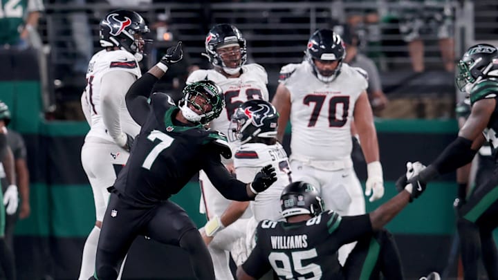 Oct 31, 2024; East Rutherford, New Jersey, USA; New York Jets defensive end Haason Reddick (7) celebrates a sack against Houston Texans quarterback C.J. Stroud (7) during the fourth quarter at MetLife Stadium. Mandatory Credit: Brad Penner-Imagn Images