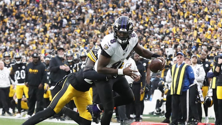 Nov 17, 2024; Pittsburgh, Pennsylvania, USA;  Pittsburgh Steelers cornerback Joey Porter Jr. (24) stops Baltimore Ravens quarterback Lamar Jackson (8) short of the end-zone on a two point conversion attempt during the fourth quarter at Acrisure Stadium. Mandatory Credit: Charles LeClaire-Imagn Images