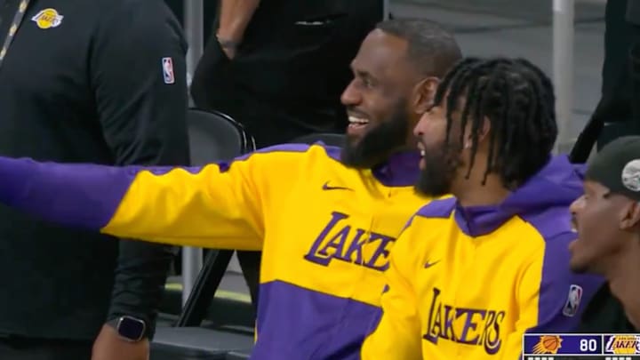 LeBron James and Anthony Davis watch a fan get ejected. 
