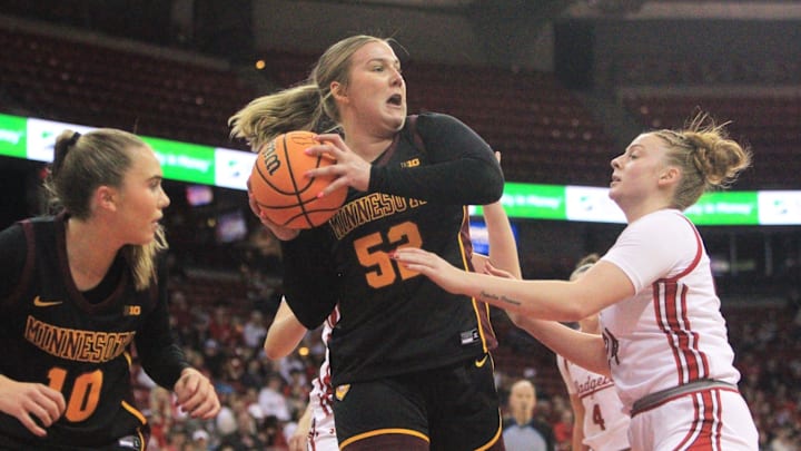 Minnesota's Sophie Hart grabs a rebound ahead of Wisconsin's Laci Stelle on Sunday Feb. 15, 2026 at the Kohl Center in Madison, Wis.