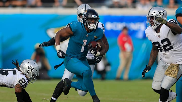 Jacksonville Jaguars running back Travis Etienne Jr. (1) rushes for yards during the fourth quarter of a regular season NFL football matchup Sunday, Nov. 6, 2022 at TIAA Bank Field in Jacksonville. The Jacksonville Jaguars held off the Las Vegas Raiders 27-20. [Corey Perrine/Florida Times-Union]

Jki 110622 Raiders Jags Cp 166